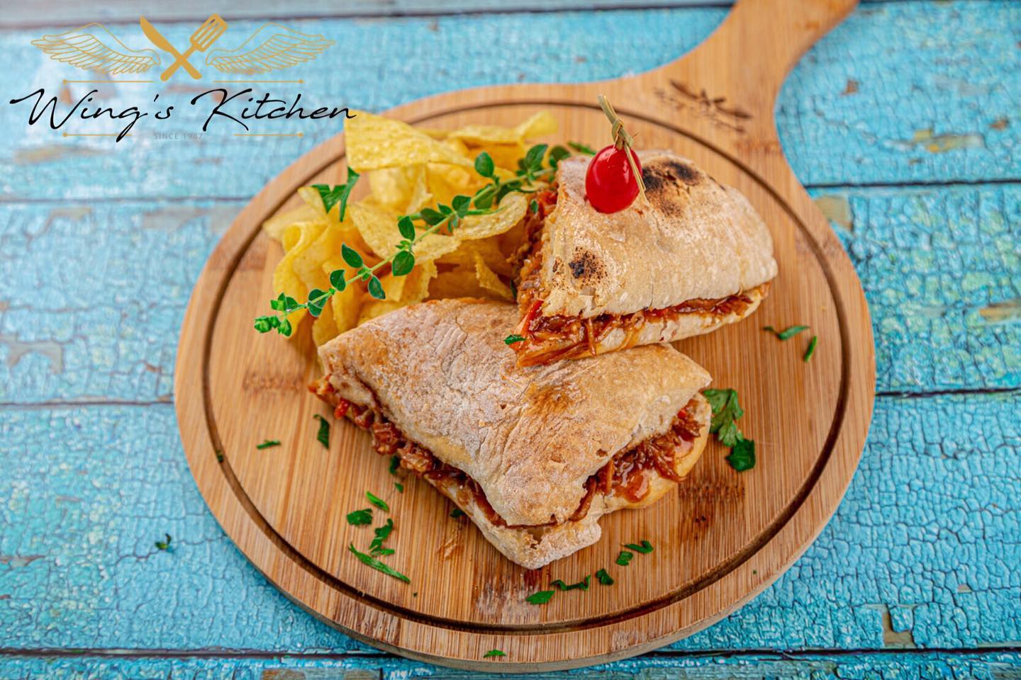 Perfectly seared scallops on a white plate with a golden sauce.