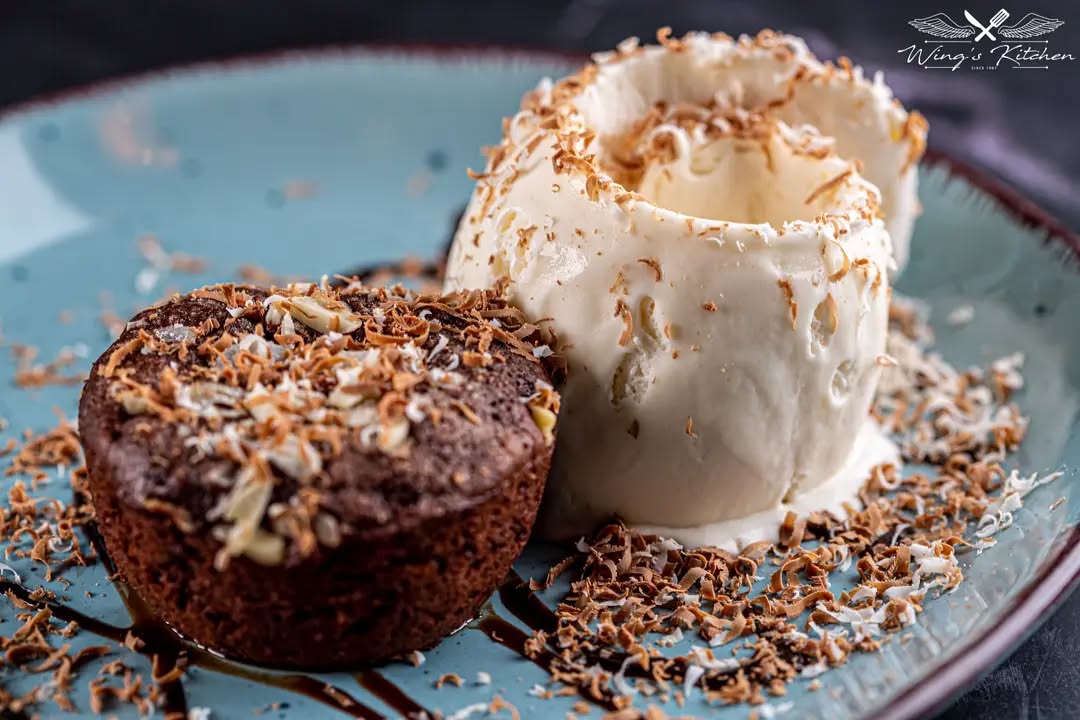 Creamy saffron risotto with large grilled prawns on top.